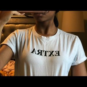white “extra” shirt